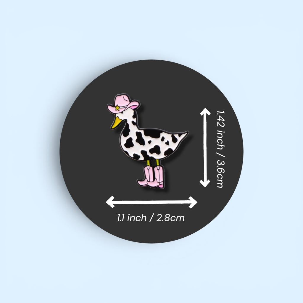Pin with a duck design wearing a cowboy hat and boots, with measurements on a black background.