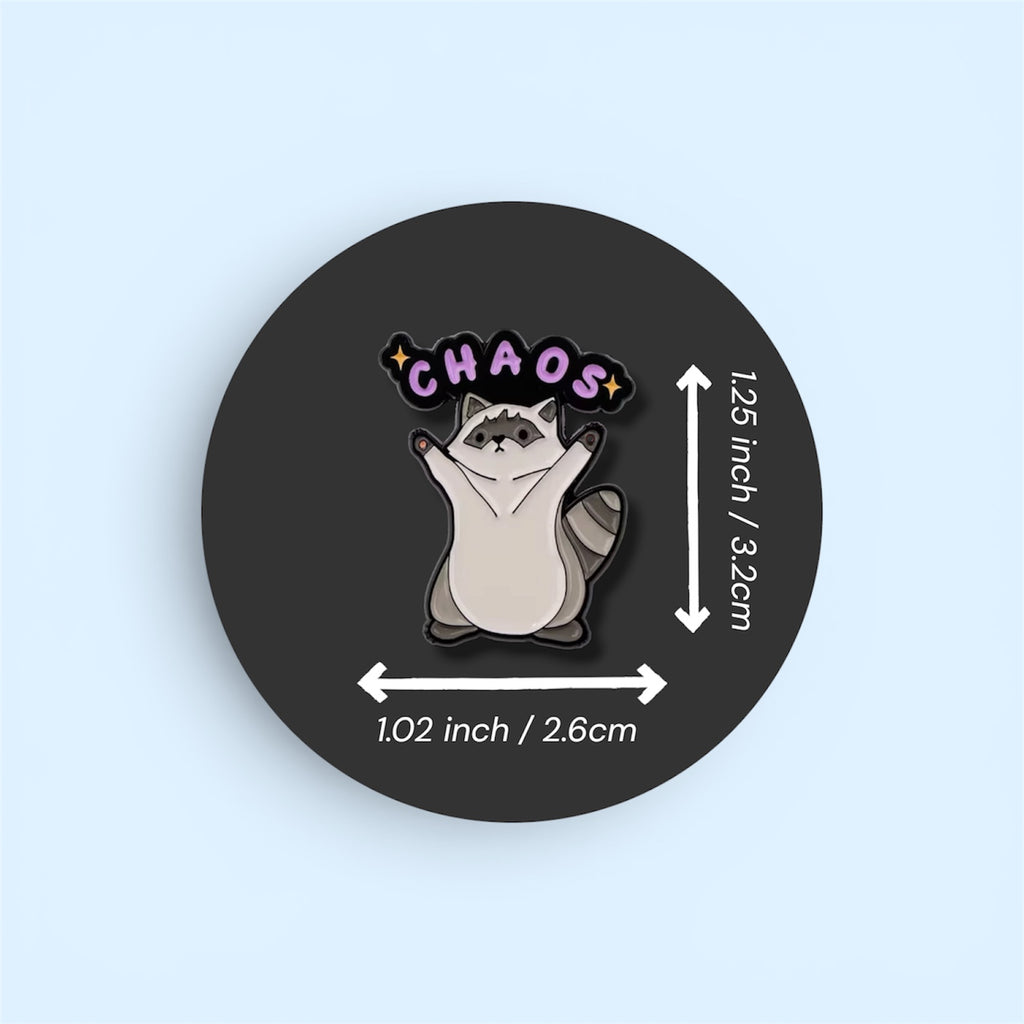 Pin with a raccoon illustration and 'CHAOS' text on a black background