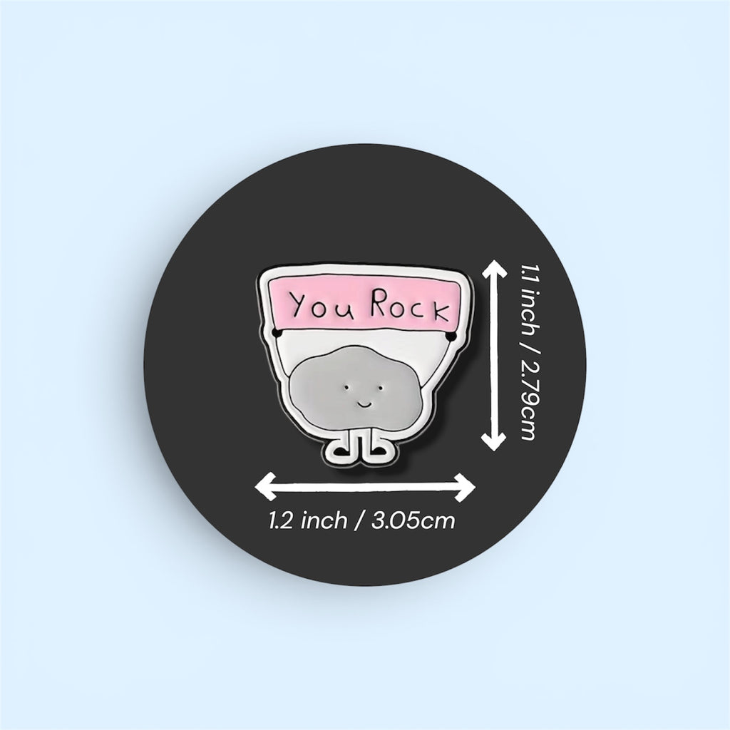Pin with 'You Rock' text and a rock design, shown on a black circle with measurements.